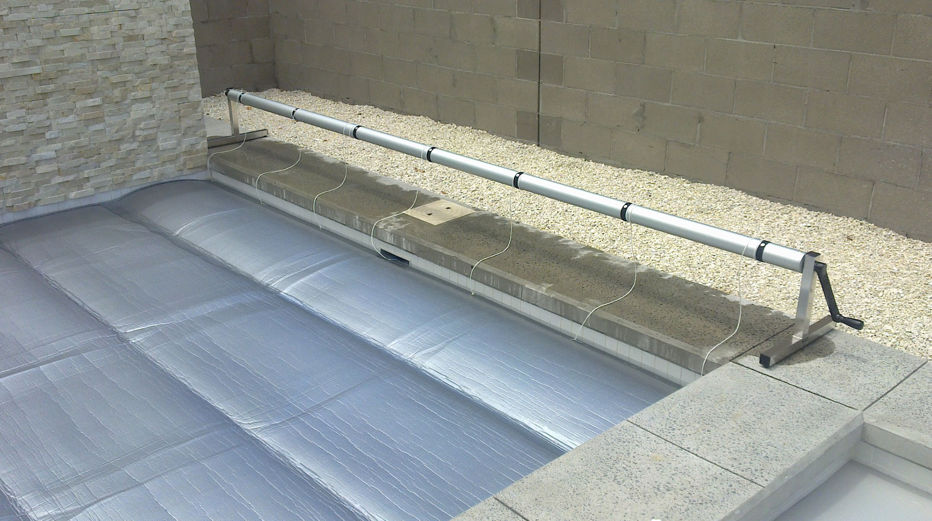 A Pool Cover Reel Makes Rolling Your Cover On And Off Your Pool Easy.